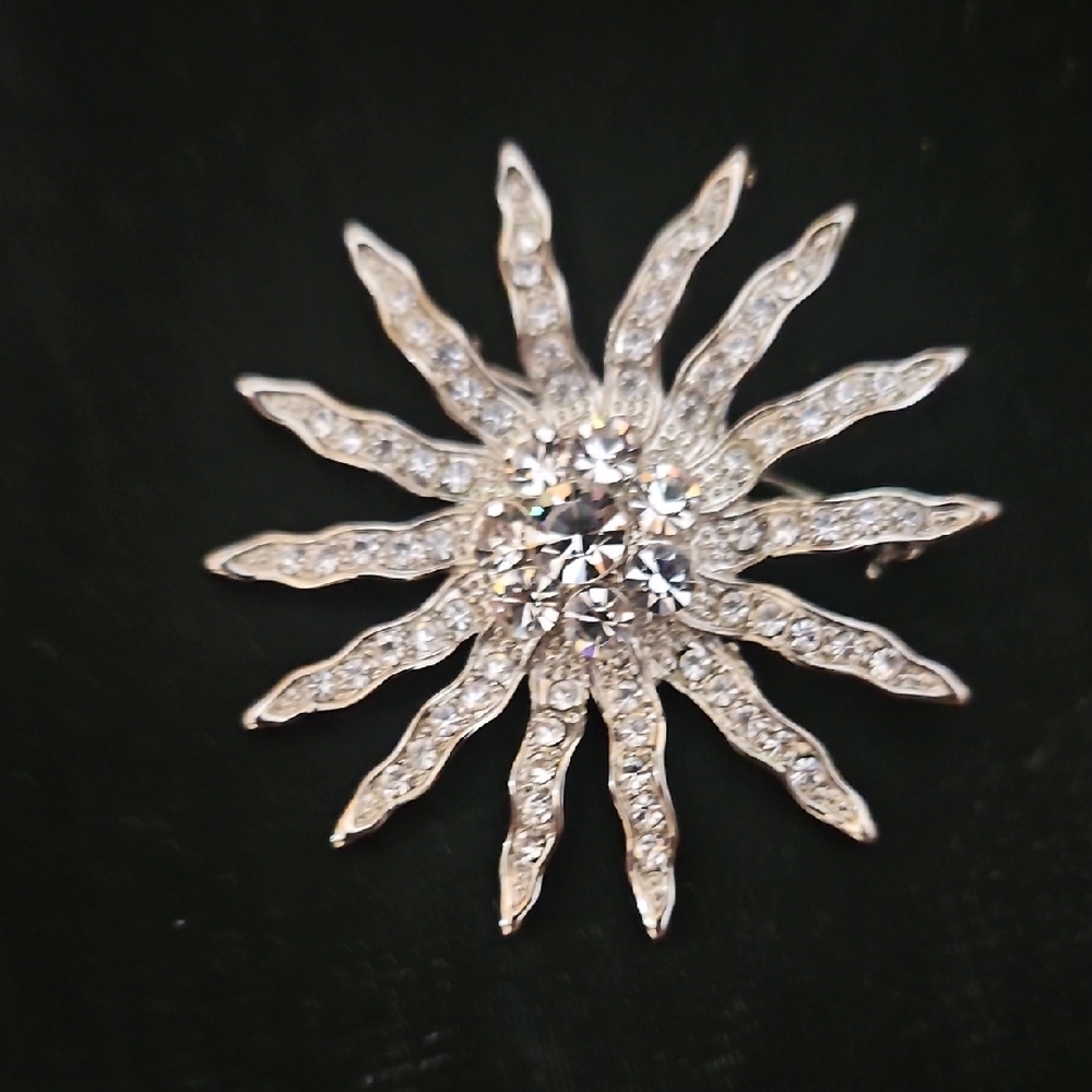 Elegant Silver Sunburst Brooch